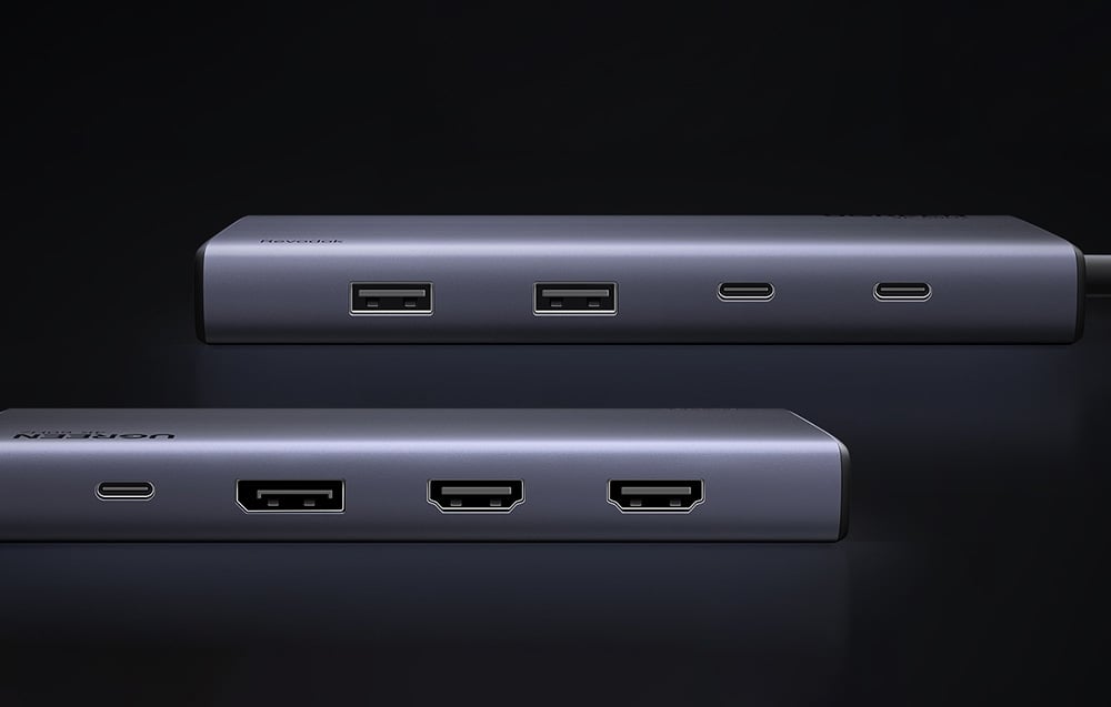 Dwa huby UGREEN z widocznymi portami USB-A, USB-C i HDMI na ciemnym tle.