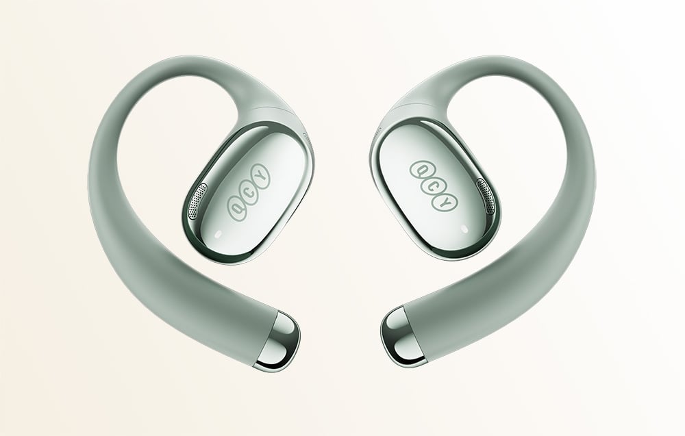 Zbliżenie na zielone bezprzewodowe słuchawki pokazujące zakrzywiony design haczyków nausznych i owalne przetworniki.