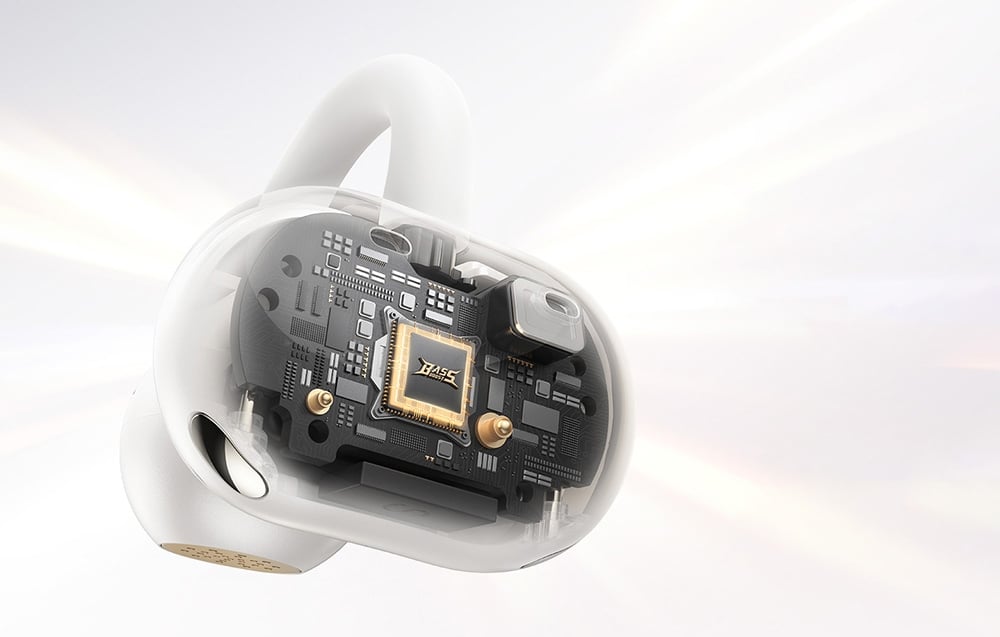 Zbliżenie na przezroczystą obudowę białej słuchawki bezprzewodowej, ukazujące szczegóły wewnętrznej elektroniki