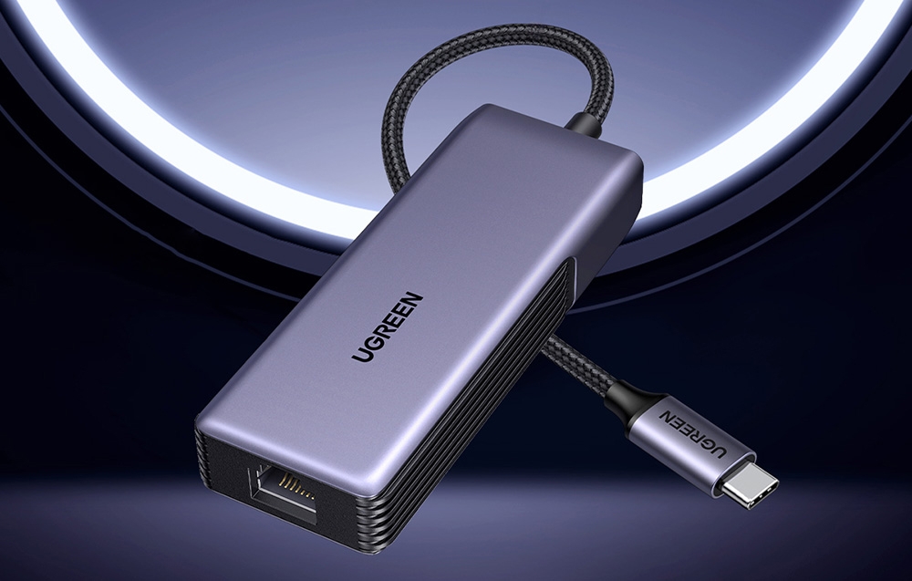 Gray network adapter with USB-C cable on a futuristic background