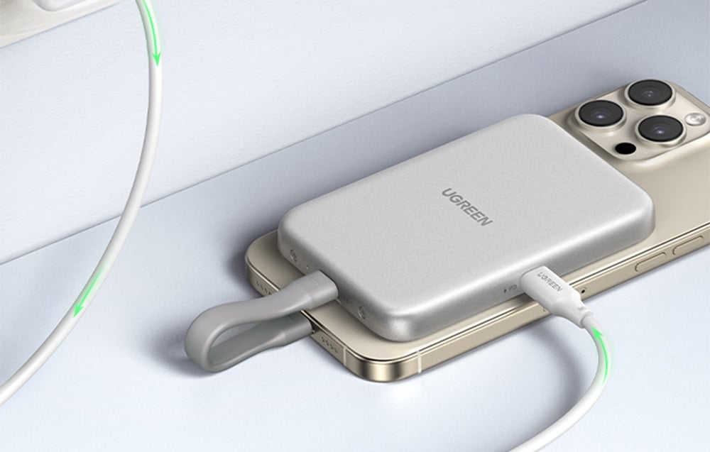 UGREEN enclosure connected to a gold iPhone while charging