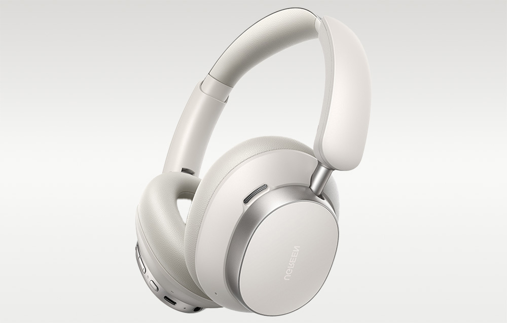 Białe słuchawki nauszne na szarym tle