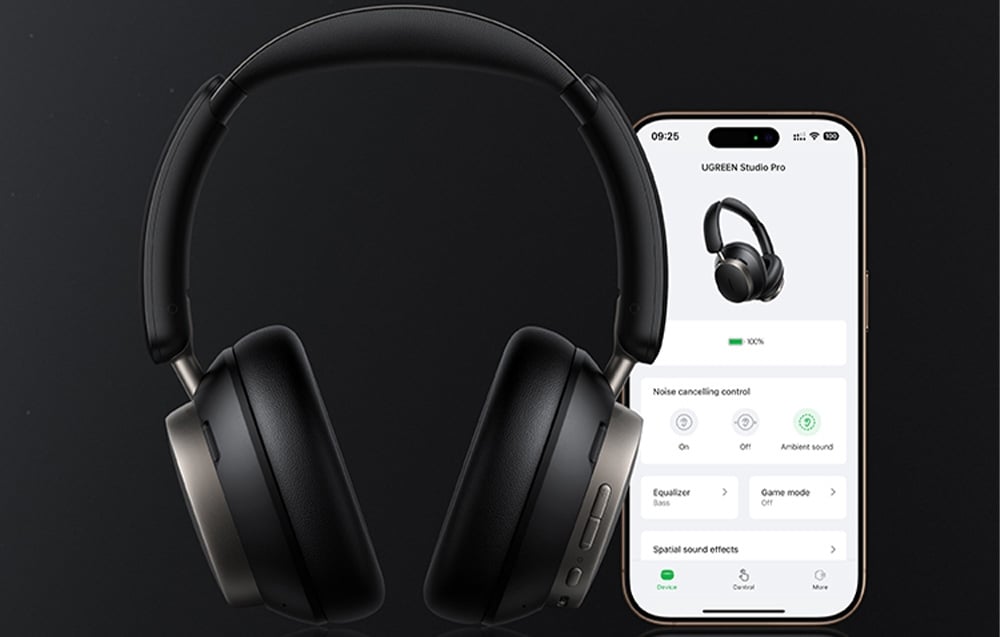 Czarne słuchawki nauszne i smartfon z aplikacją do zarządzania nimi na ciemnym tle