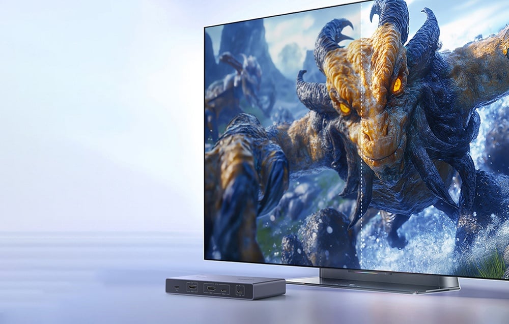 Duży telewizor z obrazem gry fantasy i przełącznikiem KVM UGREEN pod ekranem