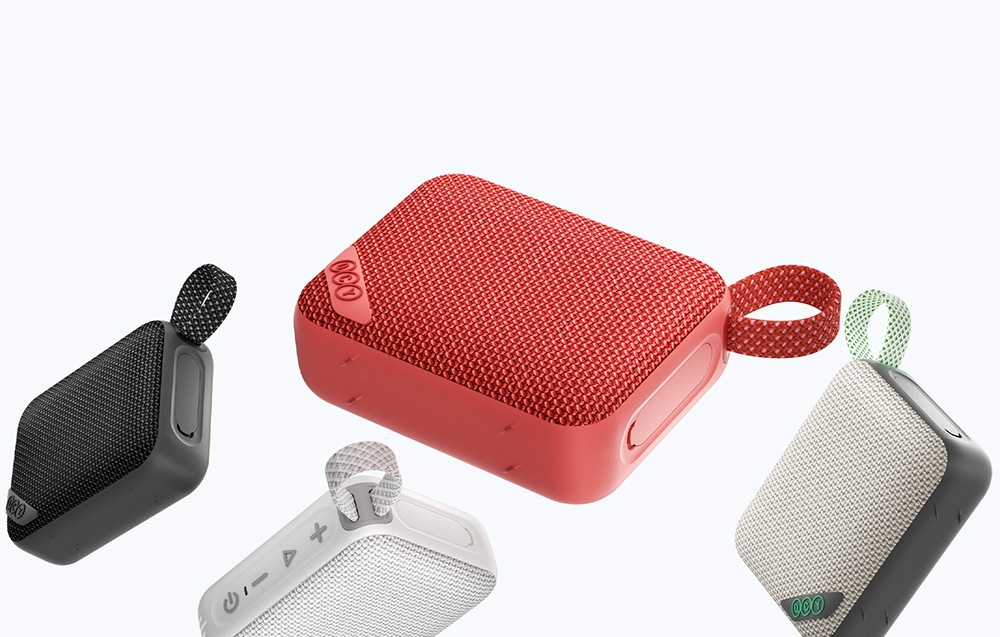 Cztery kolorowe głośniki Bluetooth na jasnym tle