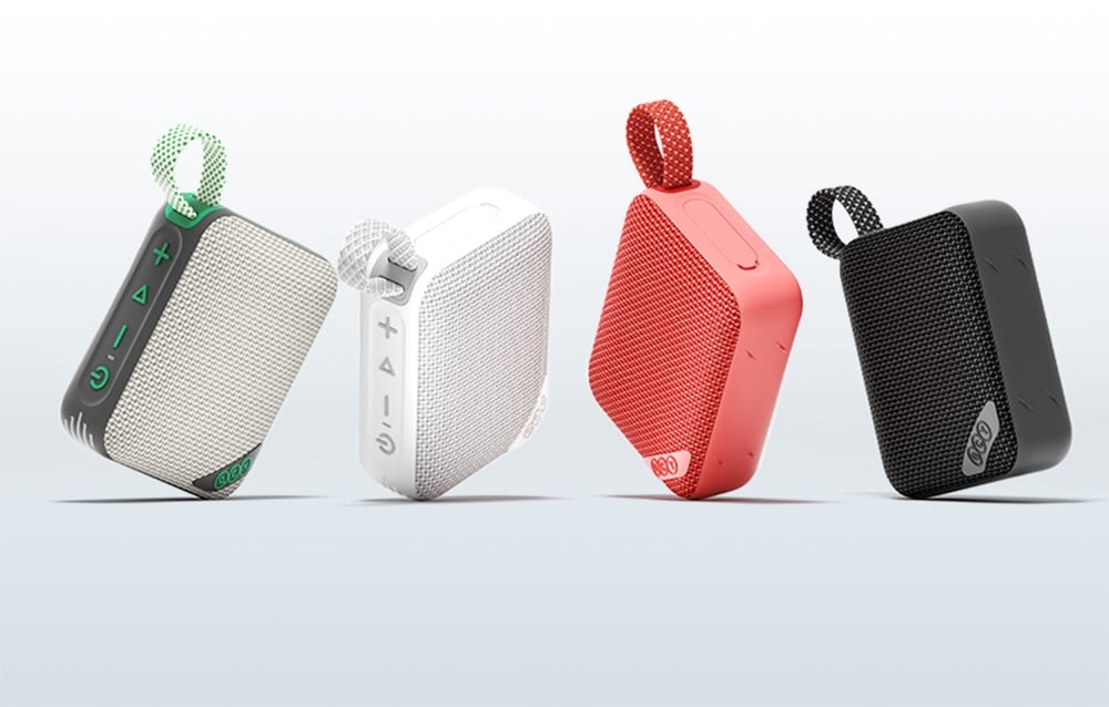 Cztery kolorowe głośniki Bluetooth w rzędzie - zielony, biały, czerwony i czarny