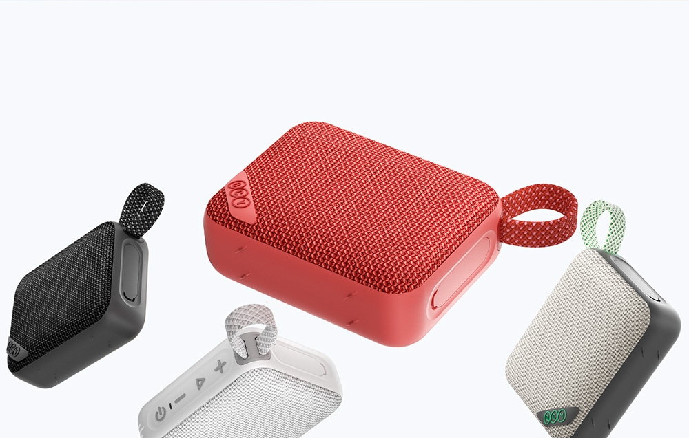 Cztery kolorowe głośniki Bluetooth na jasnym tle