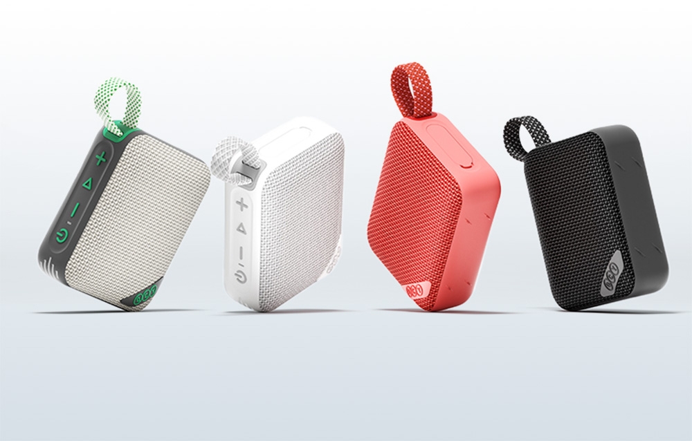 Cztery kolorowe głośniki Bluetooth w rzędzie - zielony, biały, czerwony i czarny