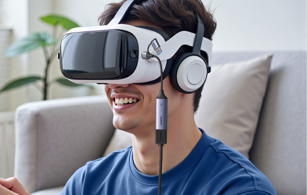 Ugreen CM629 video capture card connected to VR goggles worn by a man in a blue shirt.