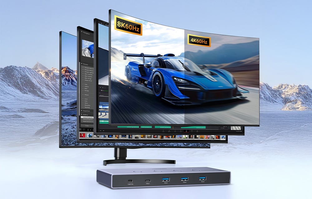 Monitor cu ecrane diferite și comutator KVM pe fundalul munților acoperiți de zăpadă