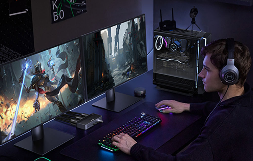 A young man playing a computer game. He is wearing headphones.