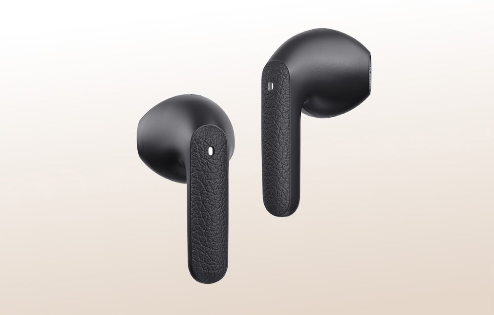 Black in-ear headphones on a light background.