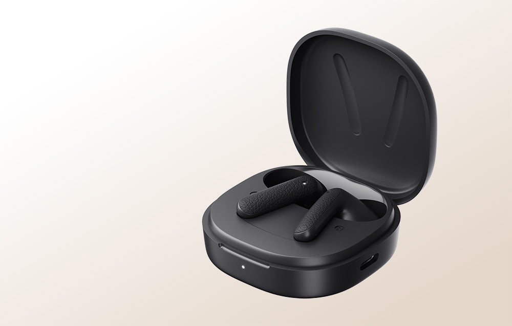 Black charging case with headphones inside.