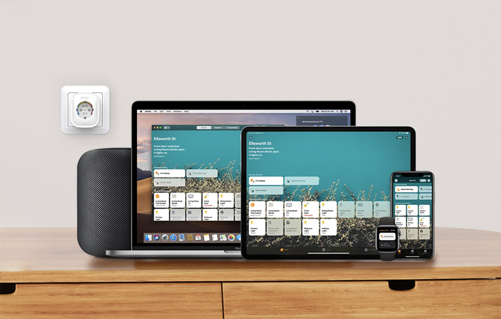 Smart socket mounted on the wall next to a set of Apple devices, including a laptop, tablet, smartphone, watch, and speaker with the home control app running