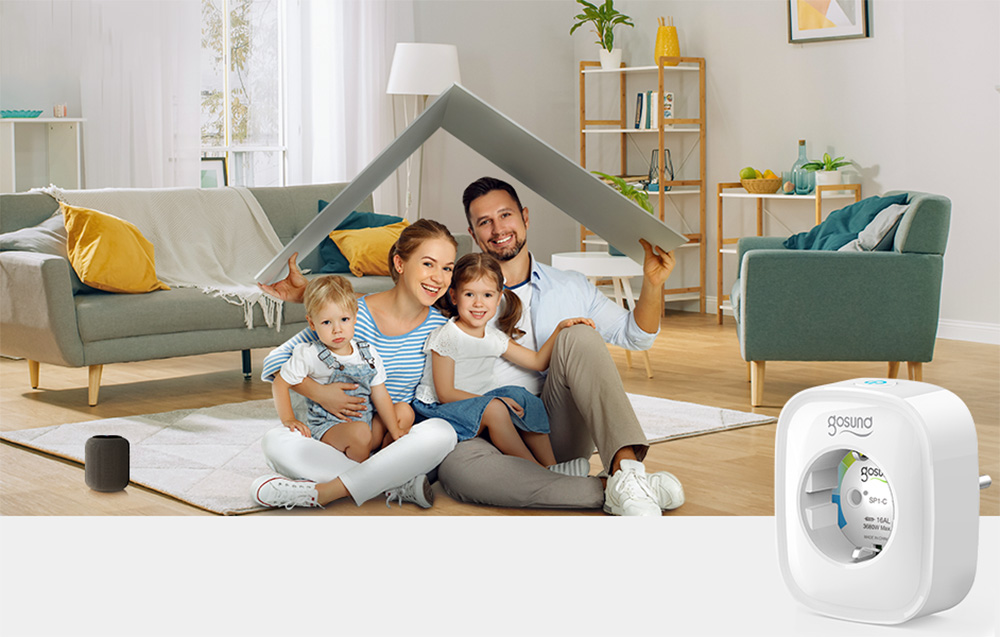 A smiling family with two children sitting on the floor in the living room, holding a blanket overhead, with the Gosund smart socket visible nearby