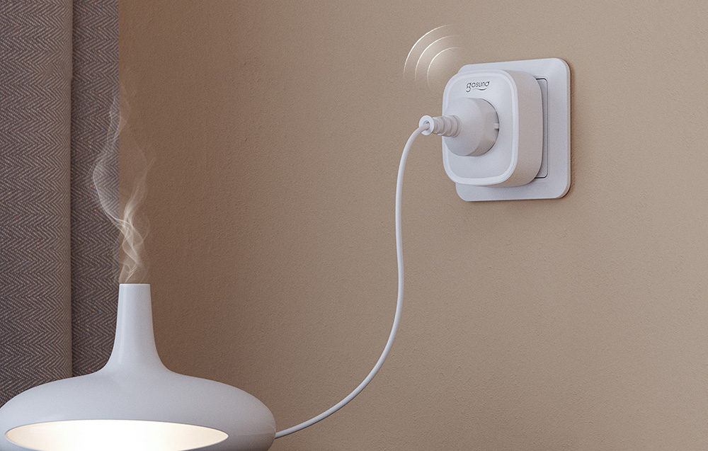 Smart socket Gosund with a connected humidifier emitting steam, mounted on the wall next to a curtain