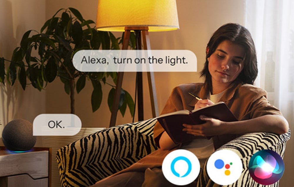 Woman on the couch using Alexa voice commands to control the light in the living room