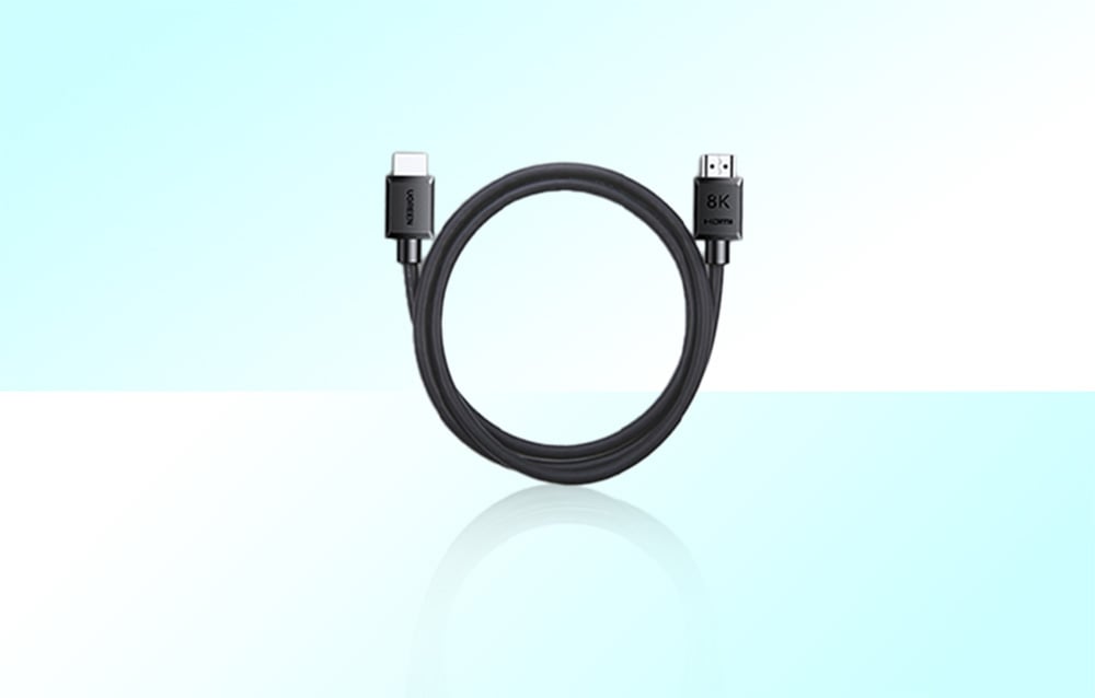 Coiled Ugreen cable on a light background