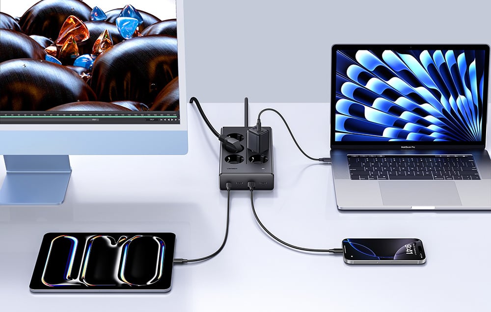Computer, laptop, smartphone, and tablet connected to the power strip