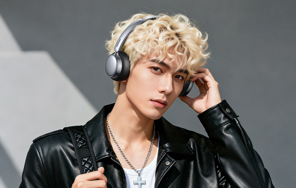 Man with blonde hair wearing headphones