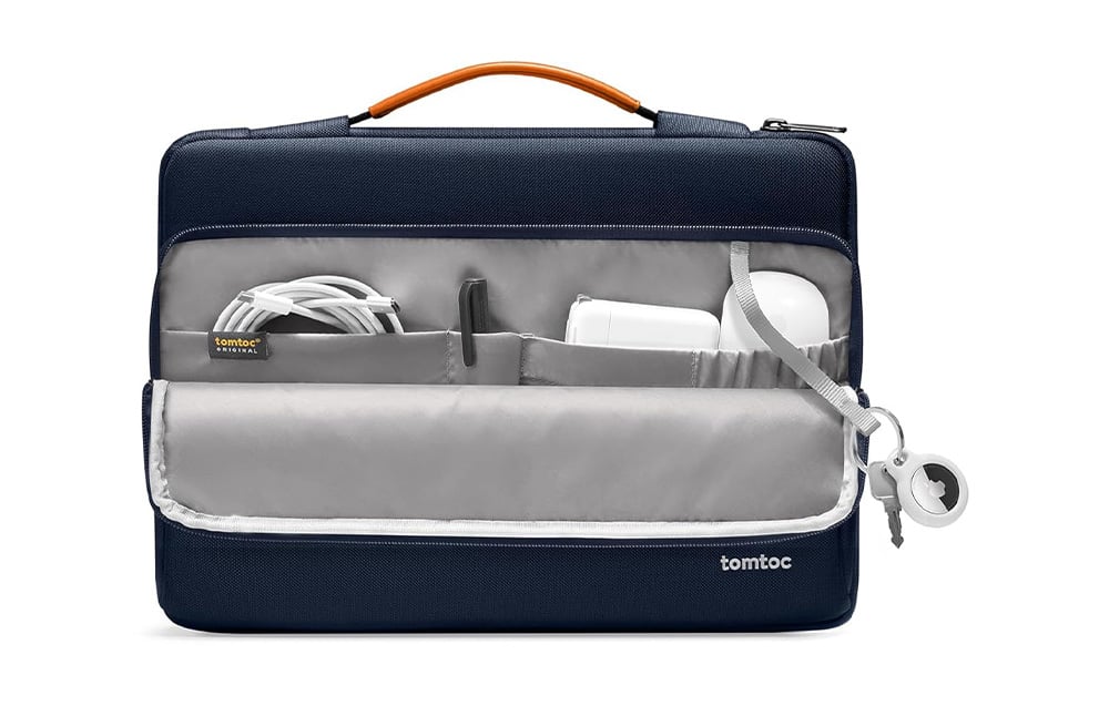 Tomtoc laptop bag with several pockets containing accessories inside