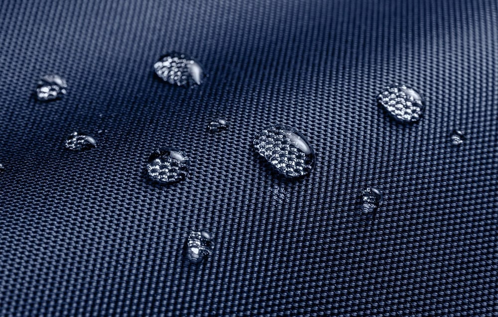 Close-up of the laptop bag surface with water droplets