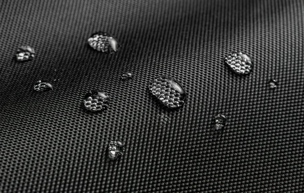 Close-up of the laptop sleeve material with water droplets