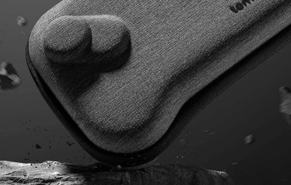 Close-up of the gray console case hitting a stone