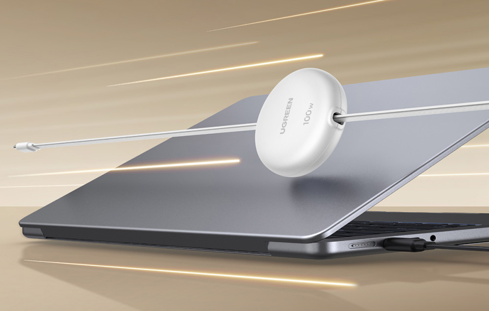 biały zwijany kabel oraz laptop