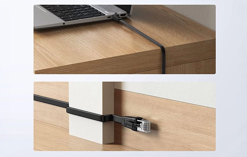 kabel podłaczony do laptopa oraz pociągnięty wzdłuż ściany