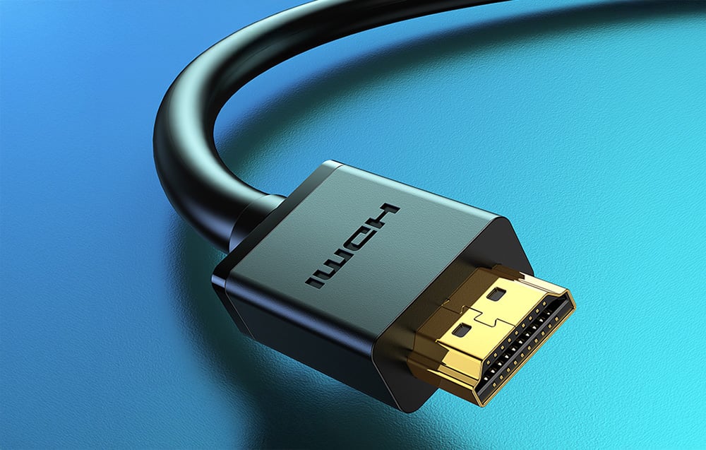 czarny kabel HDMI na niebieskim tle