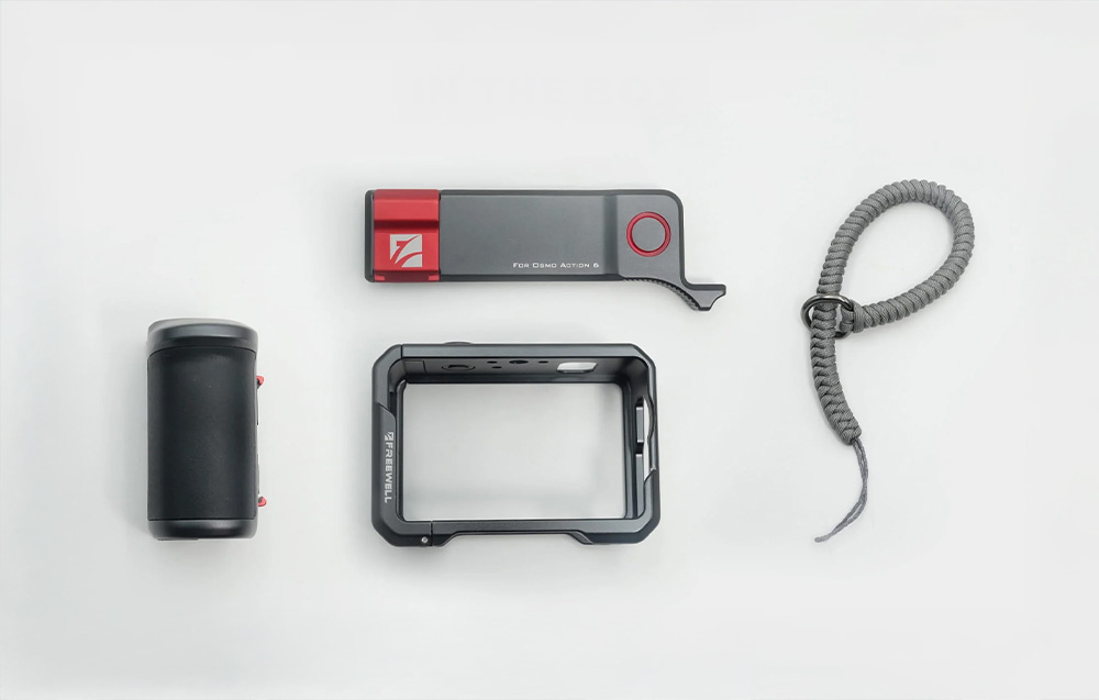 Overview of all components of the Freewell set: side handle, camera cage, top module with button, and braided wrist strap
