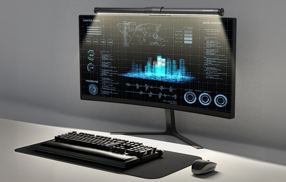 Keyboard, mouse, and monitor with lamp mounted on it