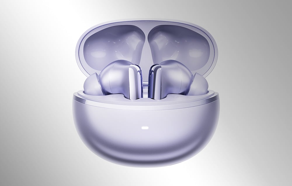 Fioletowe słuchawki bezprzewodowe umieszczone w otwartym etui ładującym na szarym tle