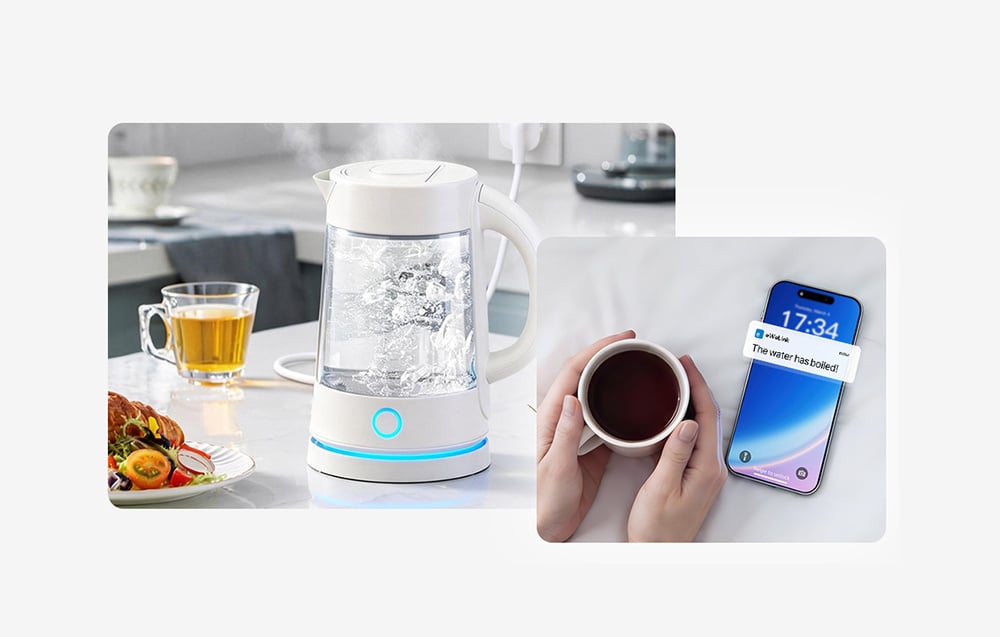 Czajnik elektryczny na stole w kuchni obok szklanki i talerza z jedzeniem, obok trzymany w dłoniach kubek z kawą i smartfon wyświetlający powiadomienie