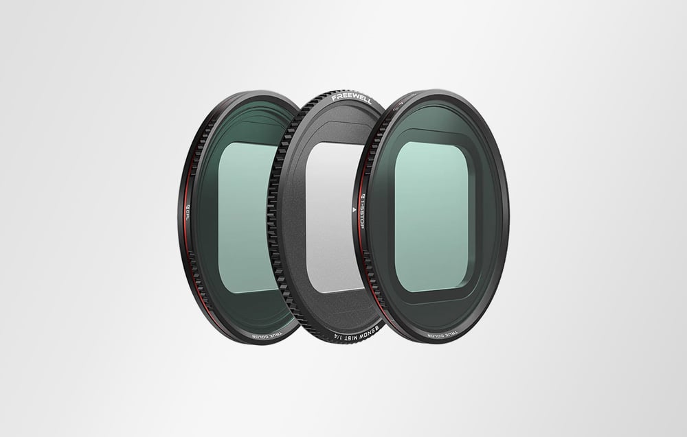 Three different types of glass photographic filters in black frames set next to each other.