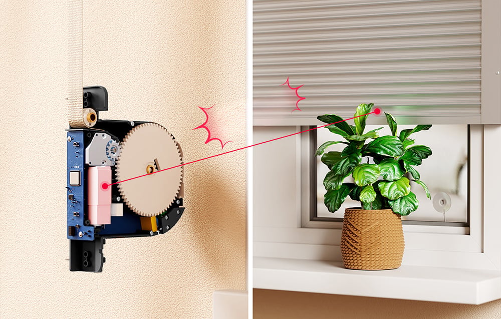 Internal mechanism of the roller shade motor, with a window and a plant on the windowsill to the right