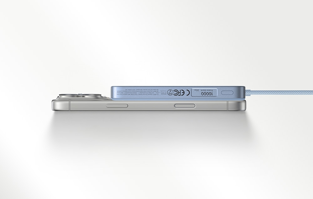 Blue power bank connected to a silver smartphone on a white background