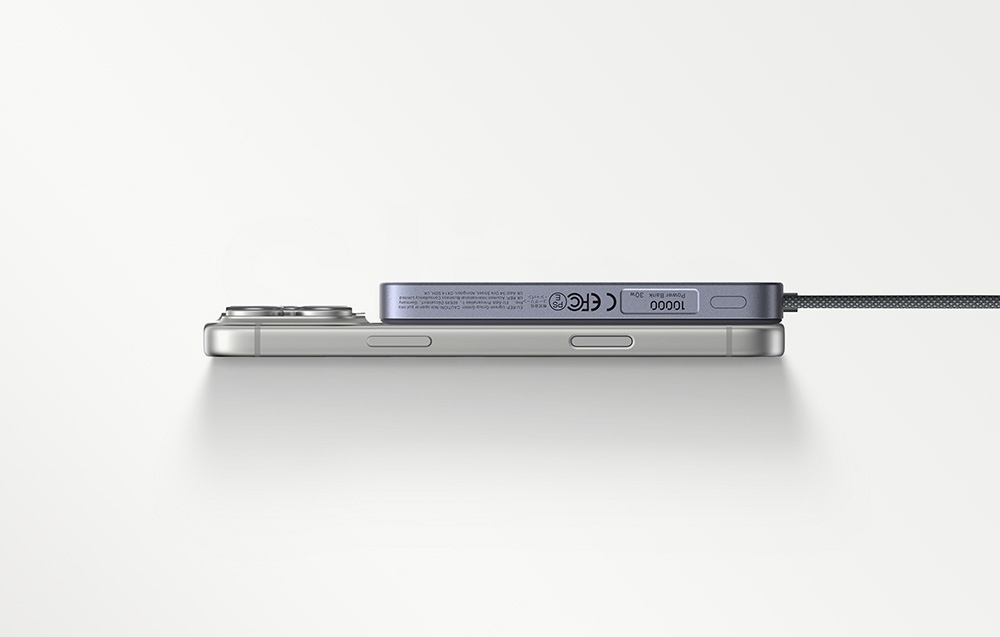 Powerbank connected to a smartphone on a light background