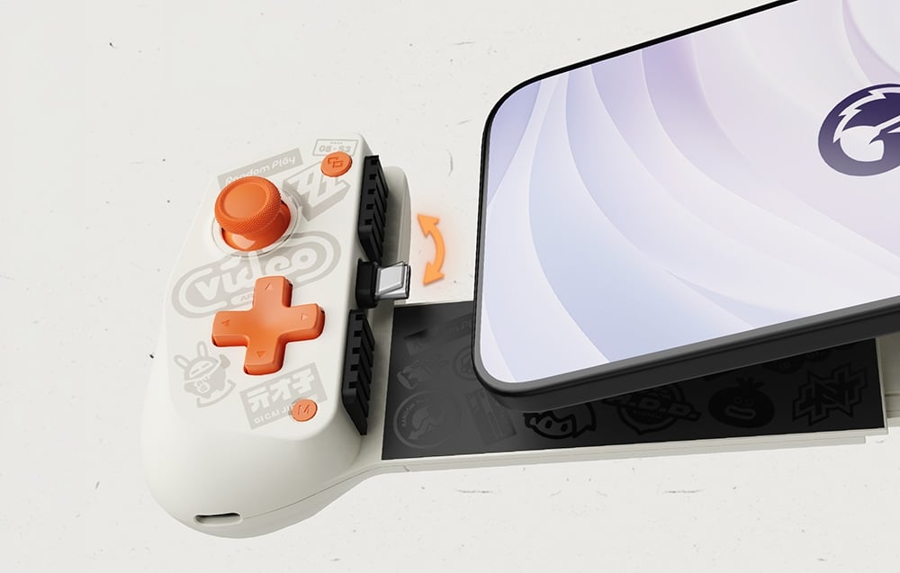 Zbliżenie na rozsuwany kontroler do smartfona z białą obudową, pomarańczowymi przyciskami i widocznym złączem USB-C