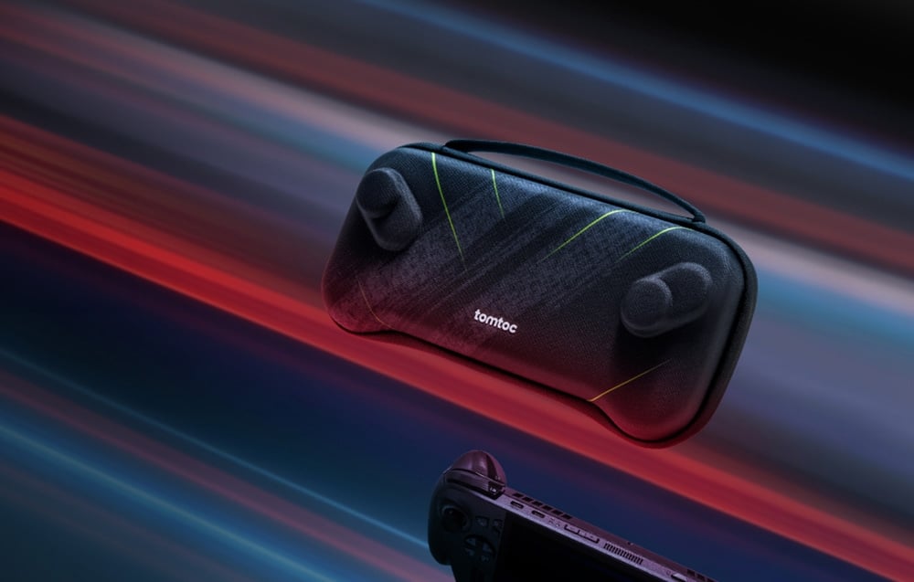 Black elongated case with a hand strap, floating in the air against a backdrop of colorful light streaks.