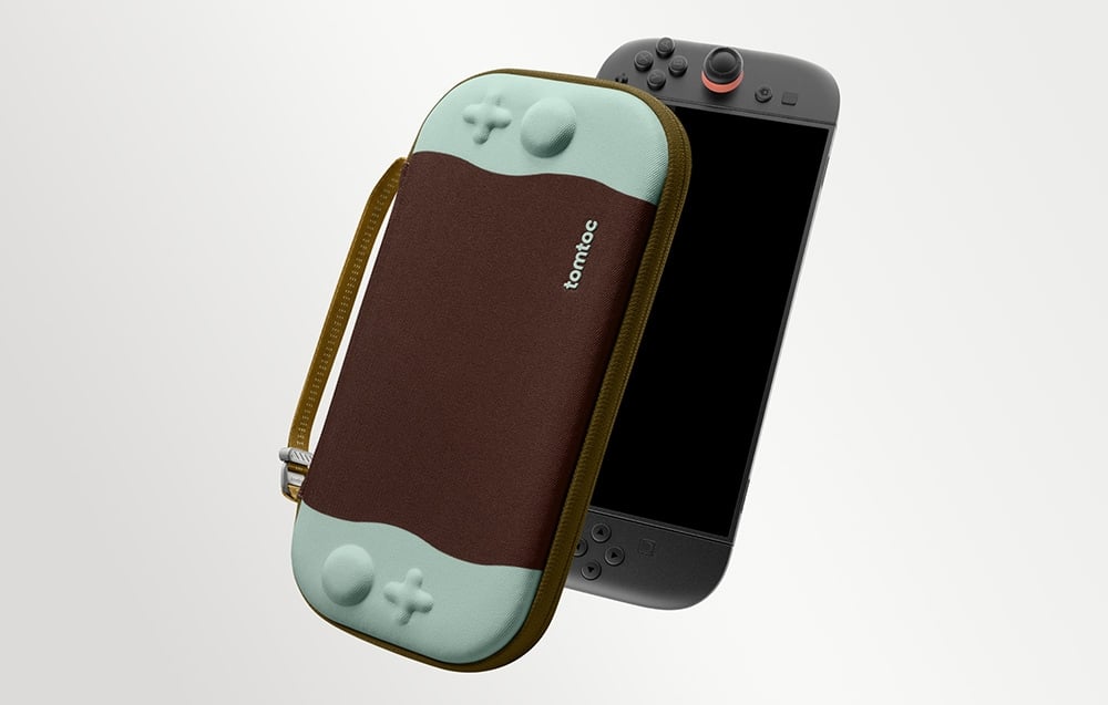 Brązowo-miętowe etui marki tomtoc unoszące się obok konsoli Nintendo Switch na jasnym tle.