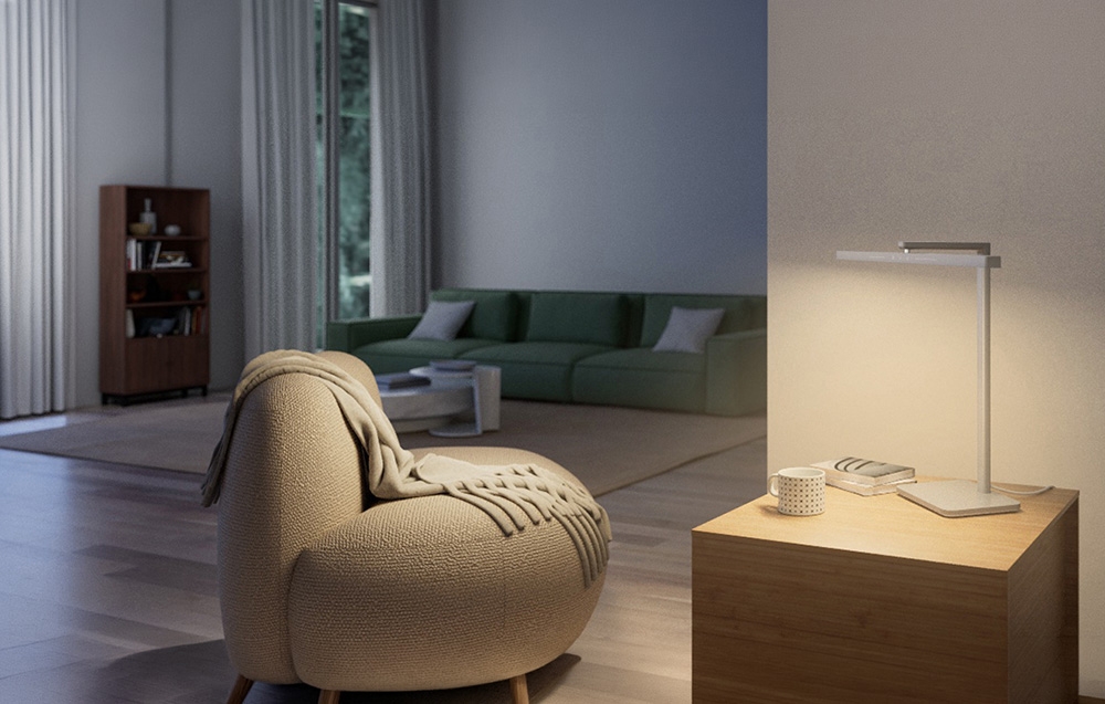 Lampă modernă, minimalistă, așezată pe o comodă din lemn în salon cu un fotoliu scandinav