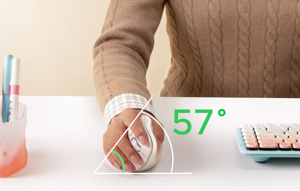 A hand holding a vertical computer mouse tilted at a 57-degree angle at a desk