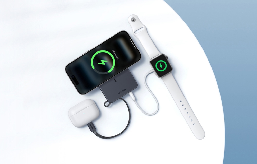 Ugreen wireless power bank powering an iPhone smartphone, Apple Watch, and AirPods simultaneously