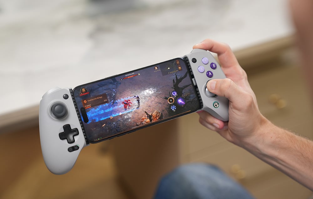 A controller held in hand with a game running on the smartphone