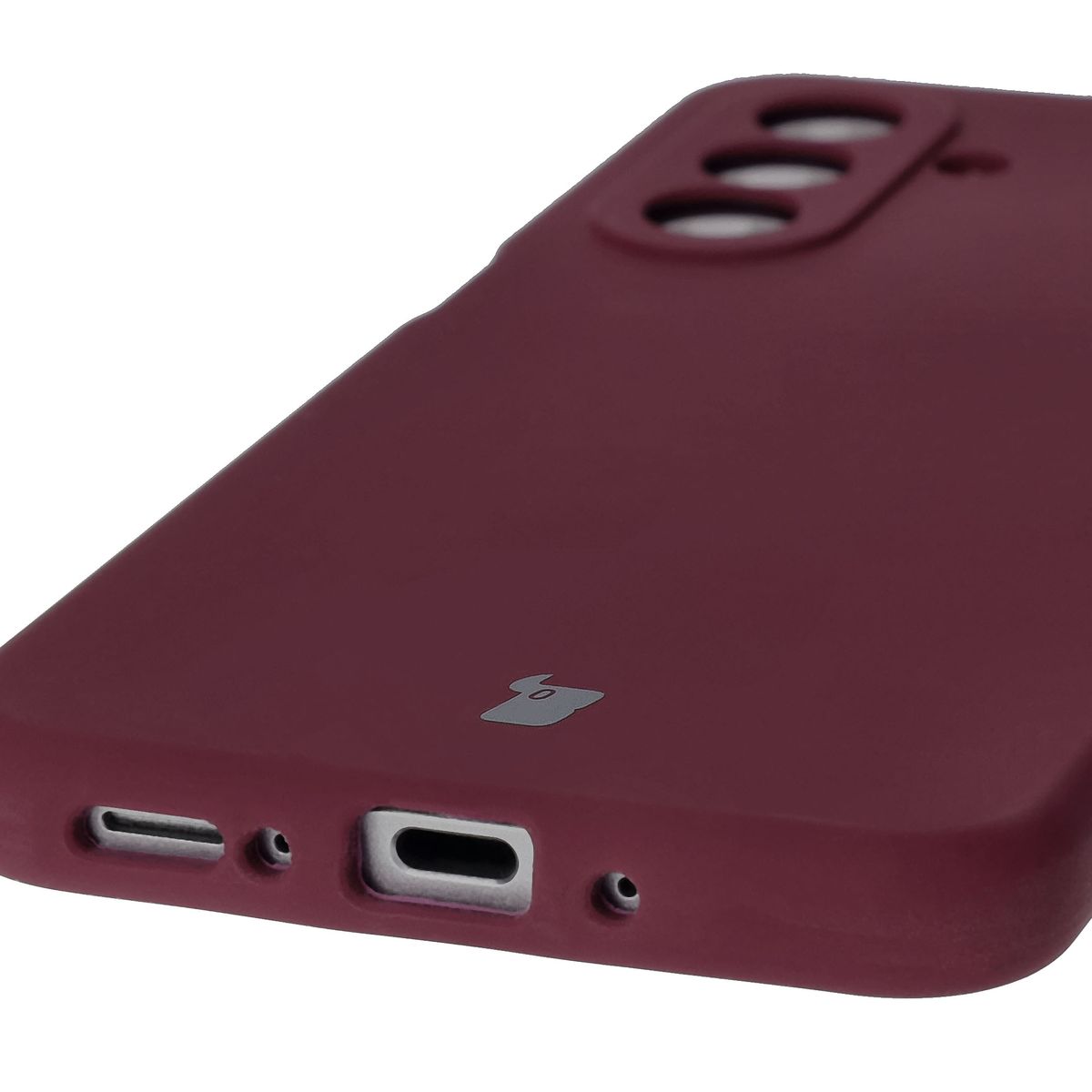 Close-up on precise cutouts and wireless charging capability in Bison Soft Case
